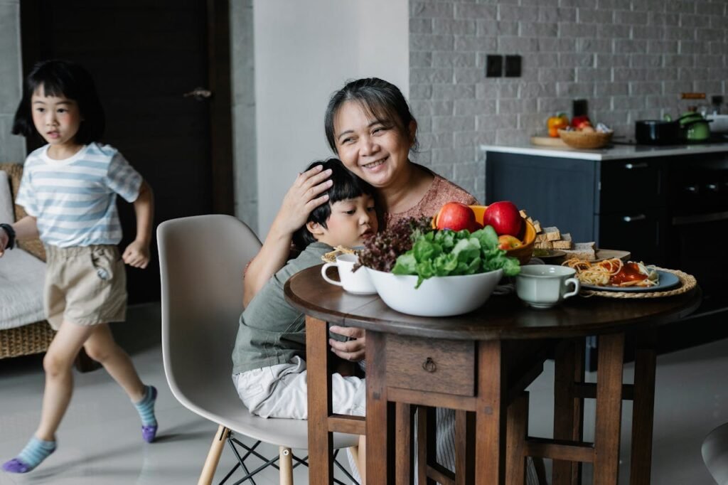 Mother holding her autistic child having gluten-free meal