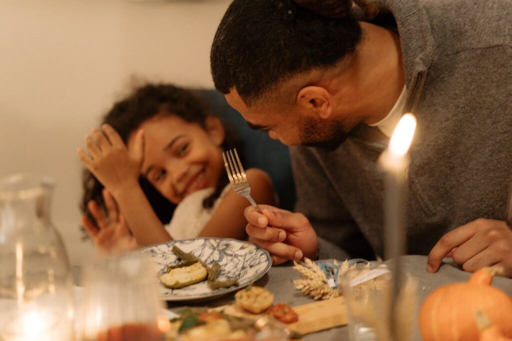 Family mealtime with a child with autism, showcasing support for food aversions.