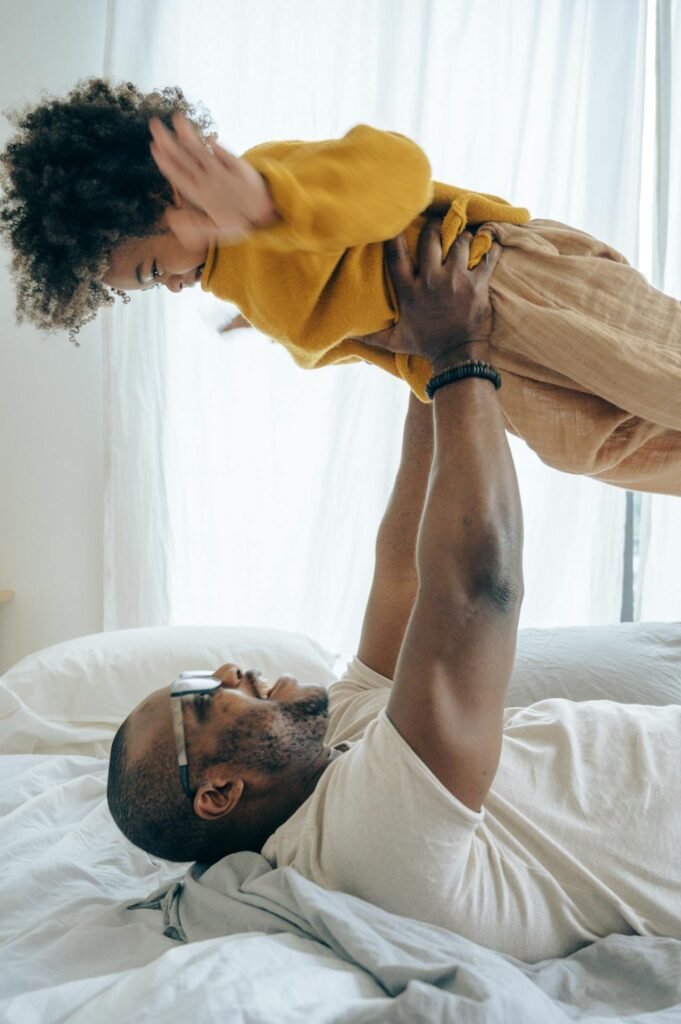 A parent holding up their nonverbal autistic child courageously.