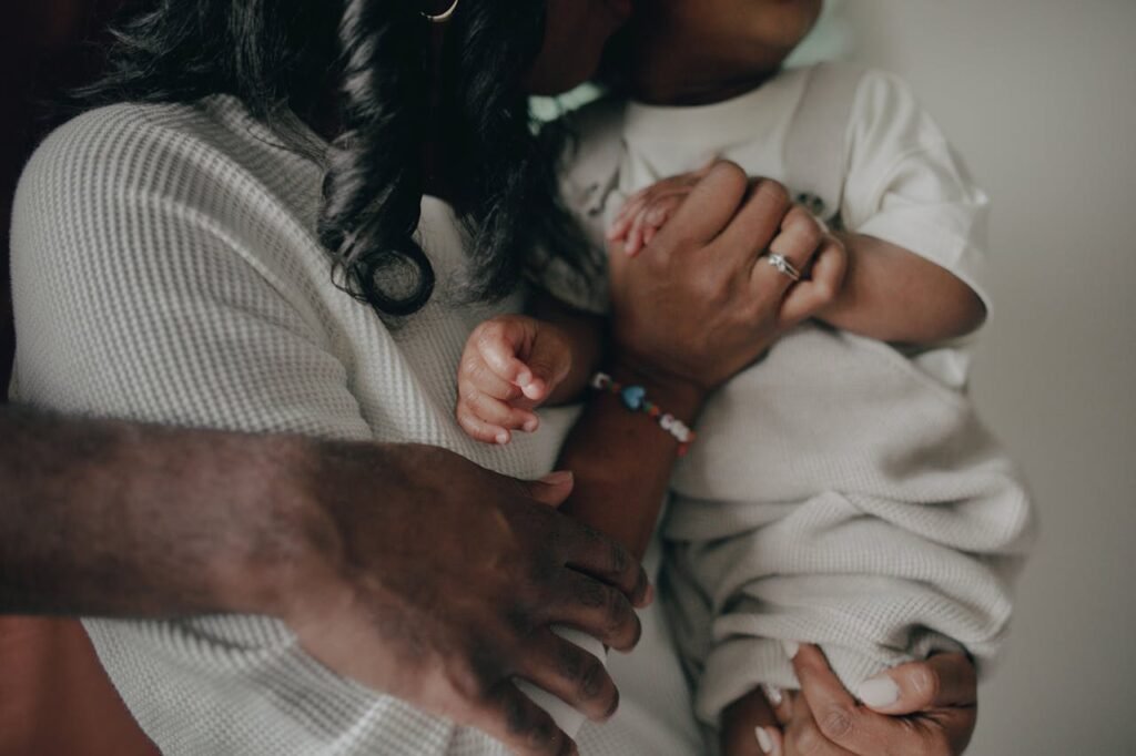 A mother and nonverbal autistic child sitting together, sharing a quiet moment of connection and love.