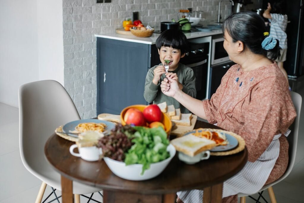 Parent and child enjoying a healthy meal for autism nutrition.