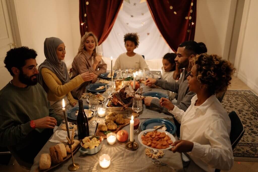 Diverse group sharing a meal, representing empathy and inclusivity for autism.