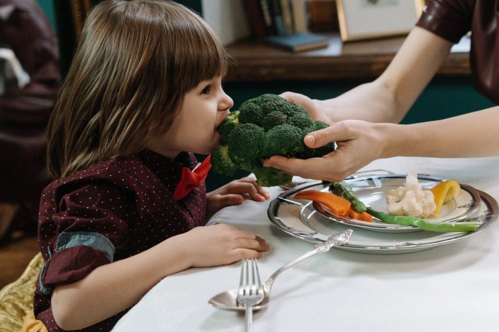 Child enjoying a healthy meal for autism nutrition.