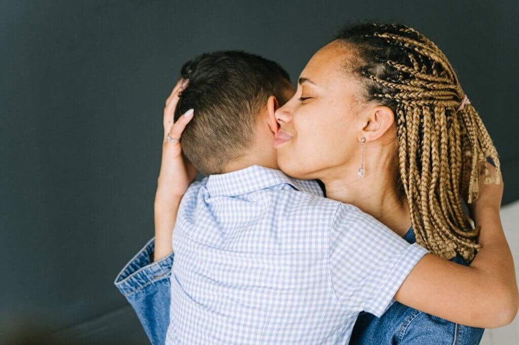 A parent and nonverbal autistic child sharing a loving hug, symbolizing connection and hope."