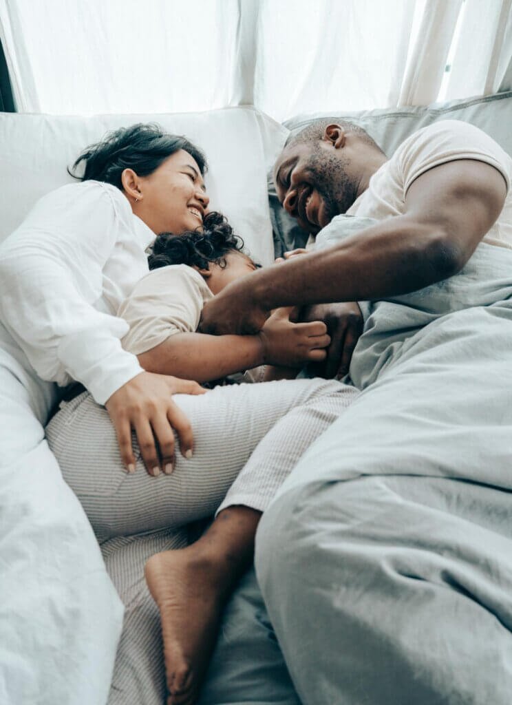 A family sharing a joyful moment with their nonverbal autistic child, celebrating unique strengths."