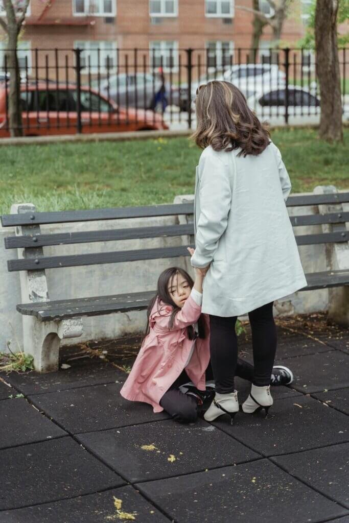 Caregiver comforting a nonverbal child during a meltdown.