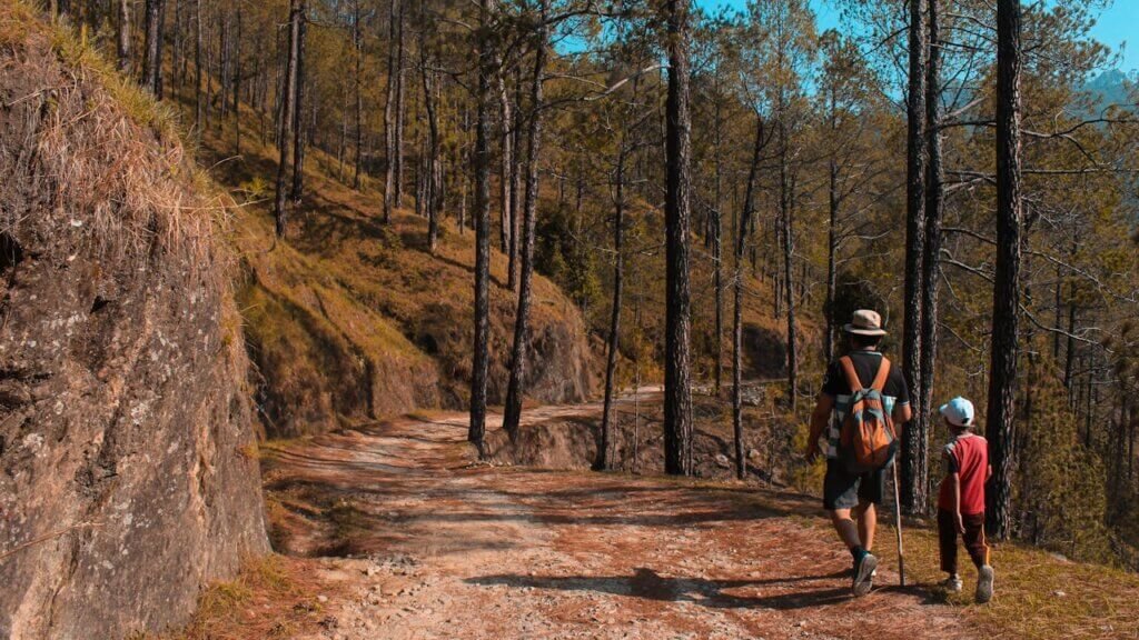 A nonverbal autistic child hiking confidently, showcasing spatial awareness and love for nature.